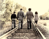 Family portrait walking along tracks
